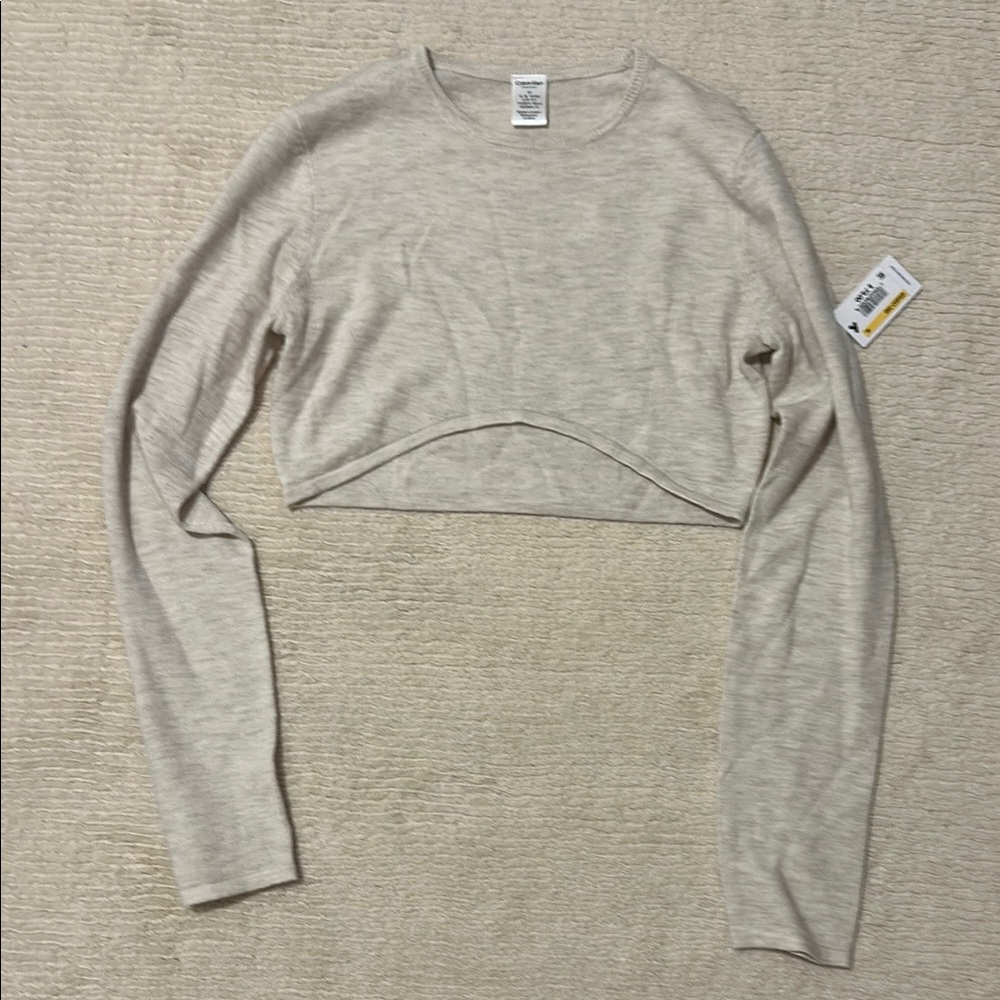 Calvin Klein Women's Cream Cropped Sweater Top with curved hem